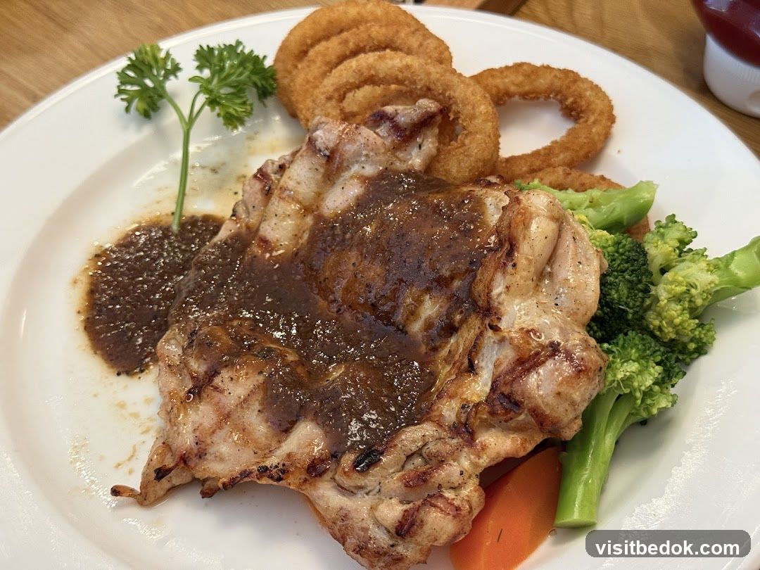 Grilled Chicken with Onion Rings and Vegetables