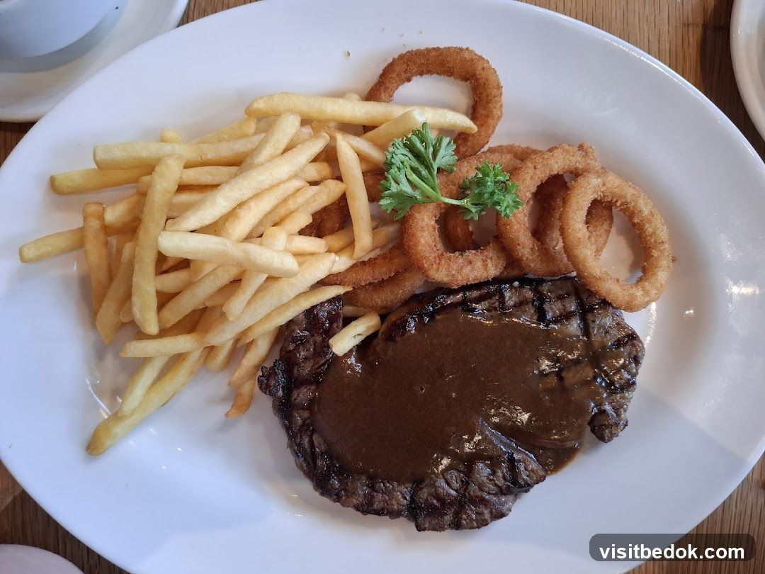 Steak with Fries and Onion Rings