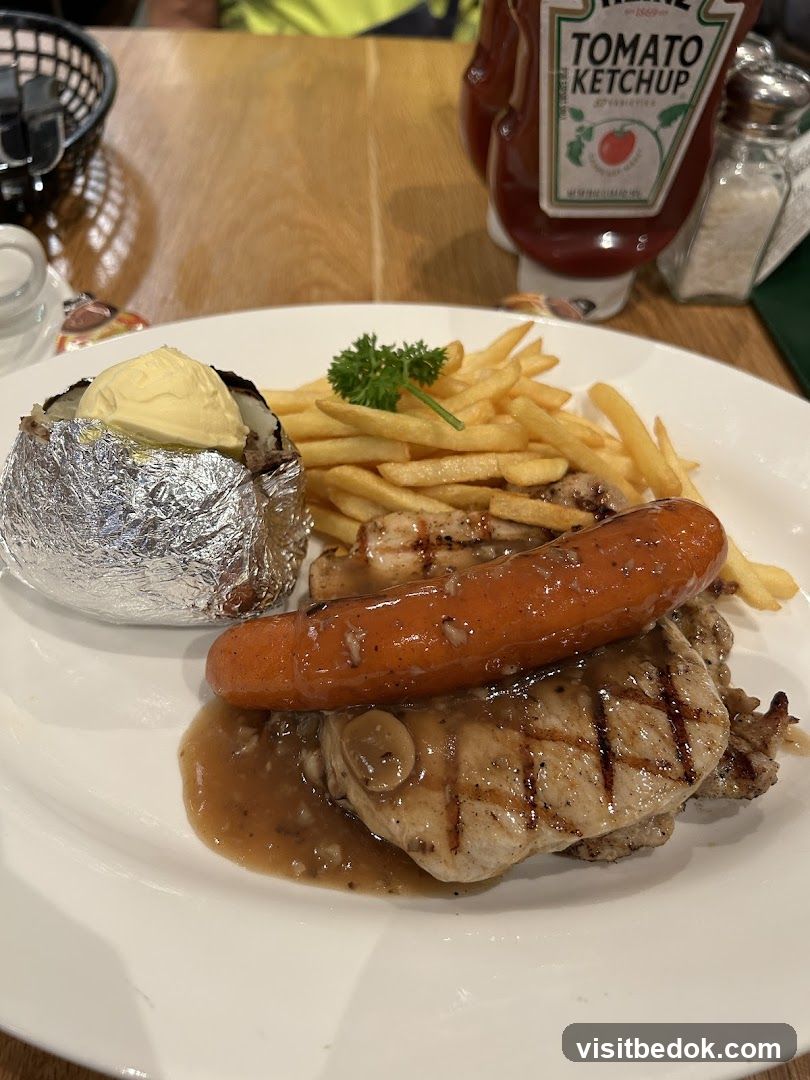 Grilled Pork Chop with Sausage and Fries