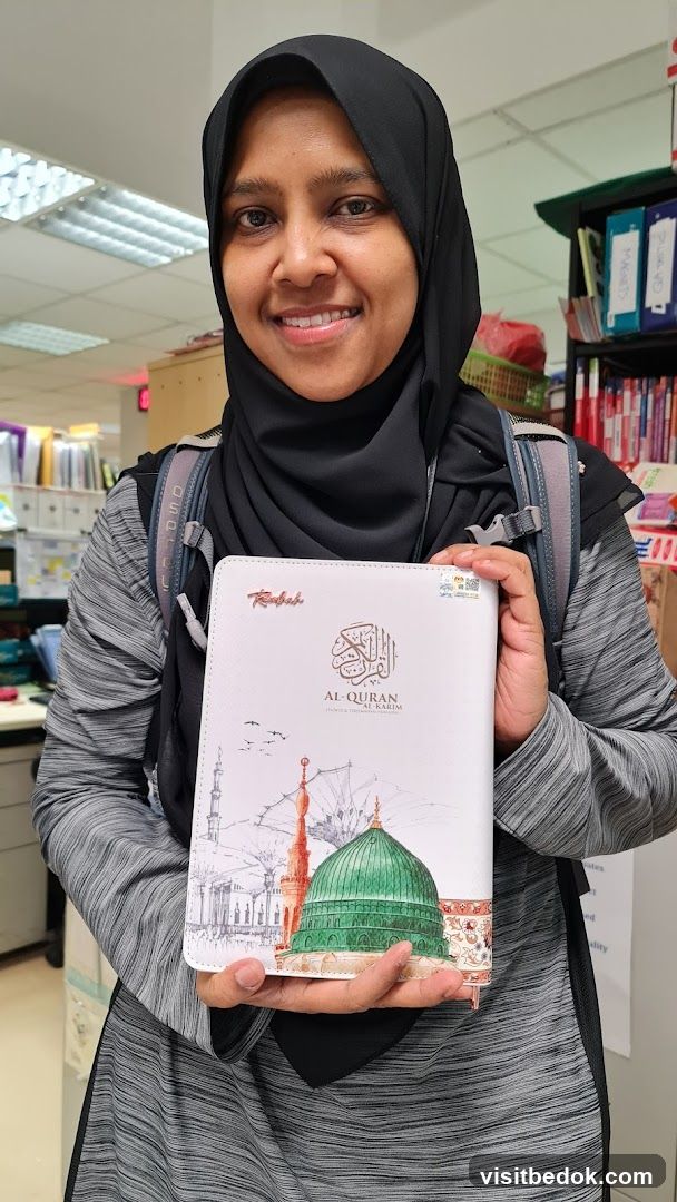 Woman holding a Quran