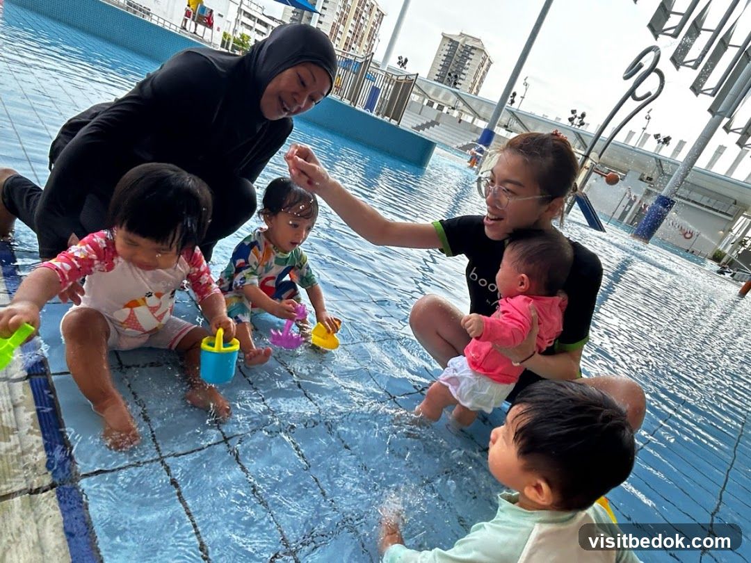 Adults and children playing in a shallow pool