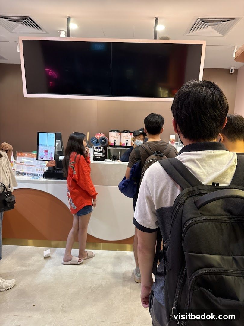 Customers in Line at a Beverage Shop