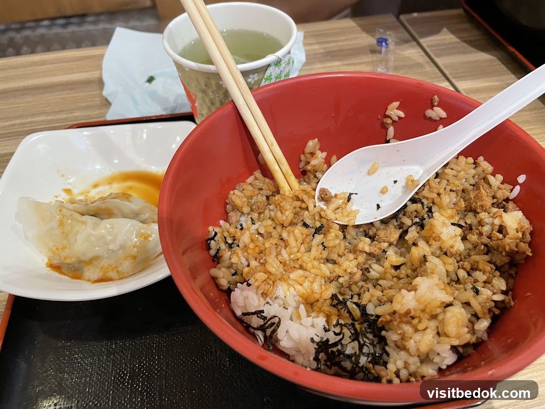 Rice bowl with dumplings and tea