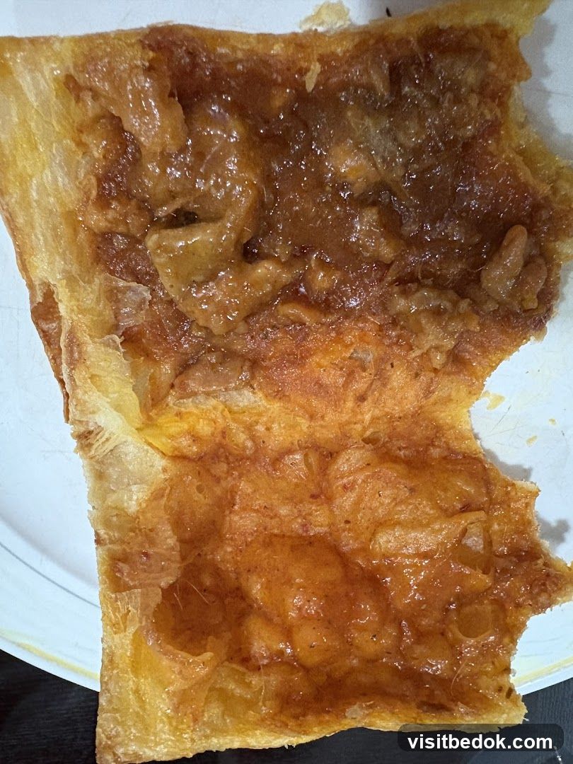 Close-up of a pastry with apple filling