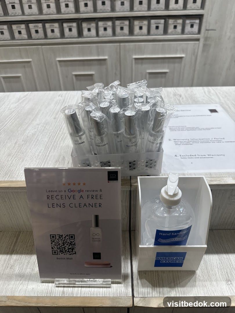 Promotional display with lens cleaner and hand sanitizer
