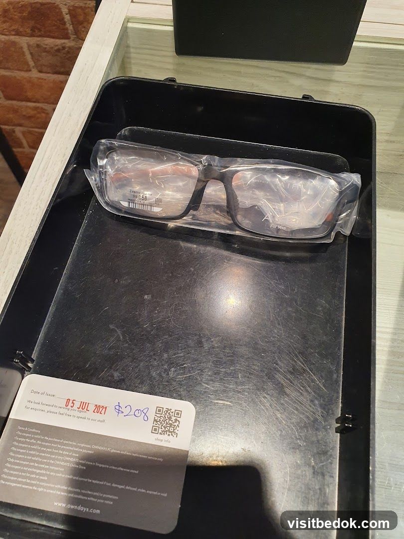 Eyeglasses in a case with a coupon