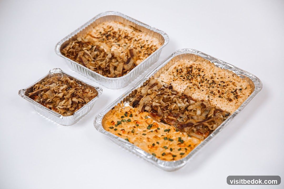 Three foil containers of food