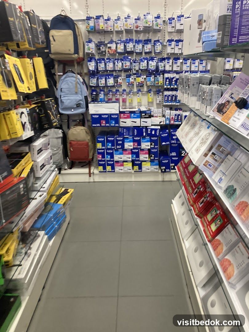 Store aisle with electronics and office supplies