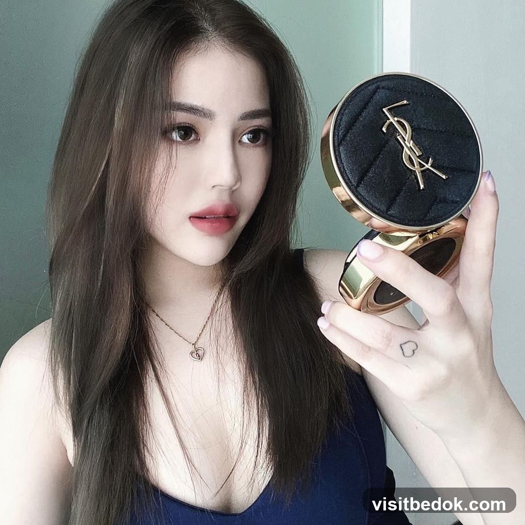 Woman holding makeup compact
