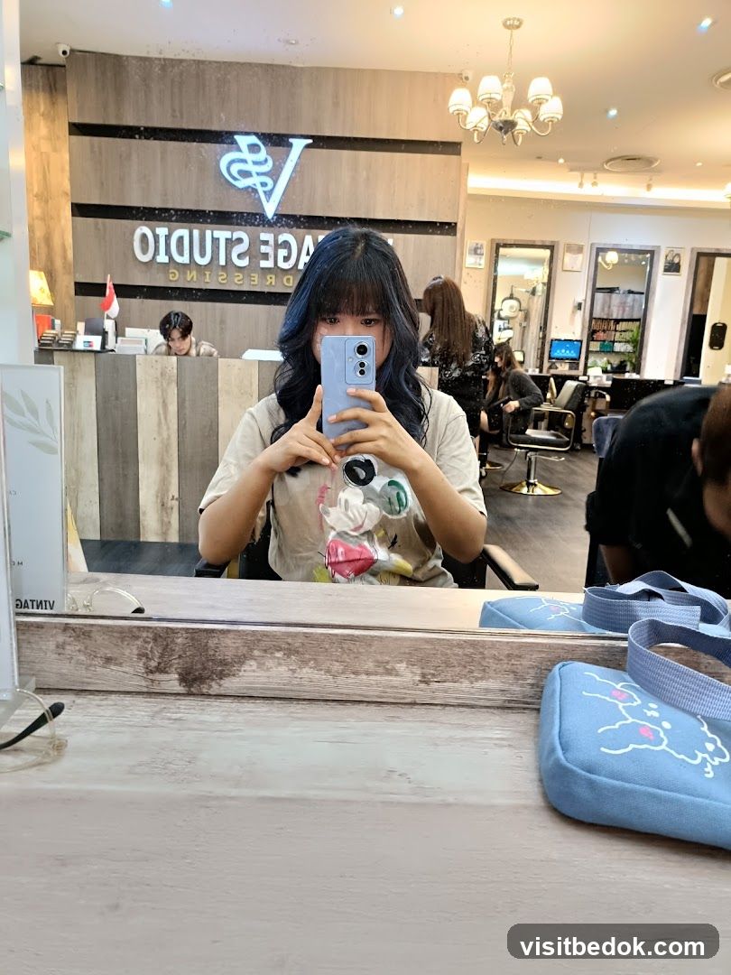 Woman taking a selfie in a salon