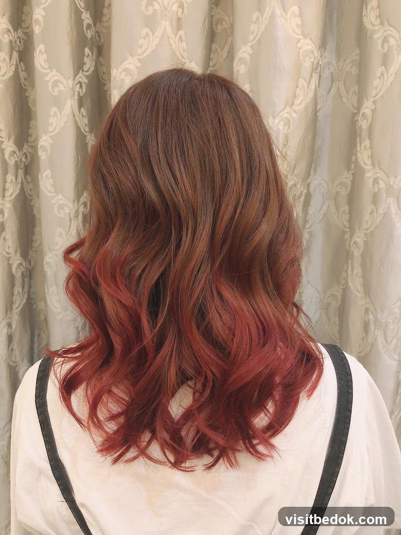 Woman with Wavy Red Ombre Hair
