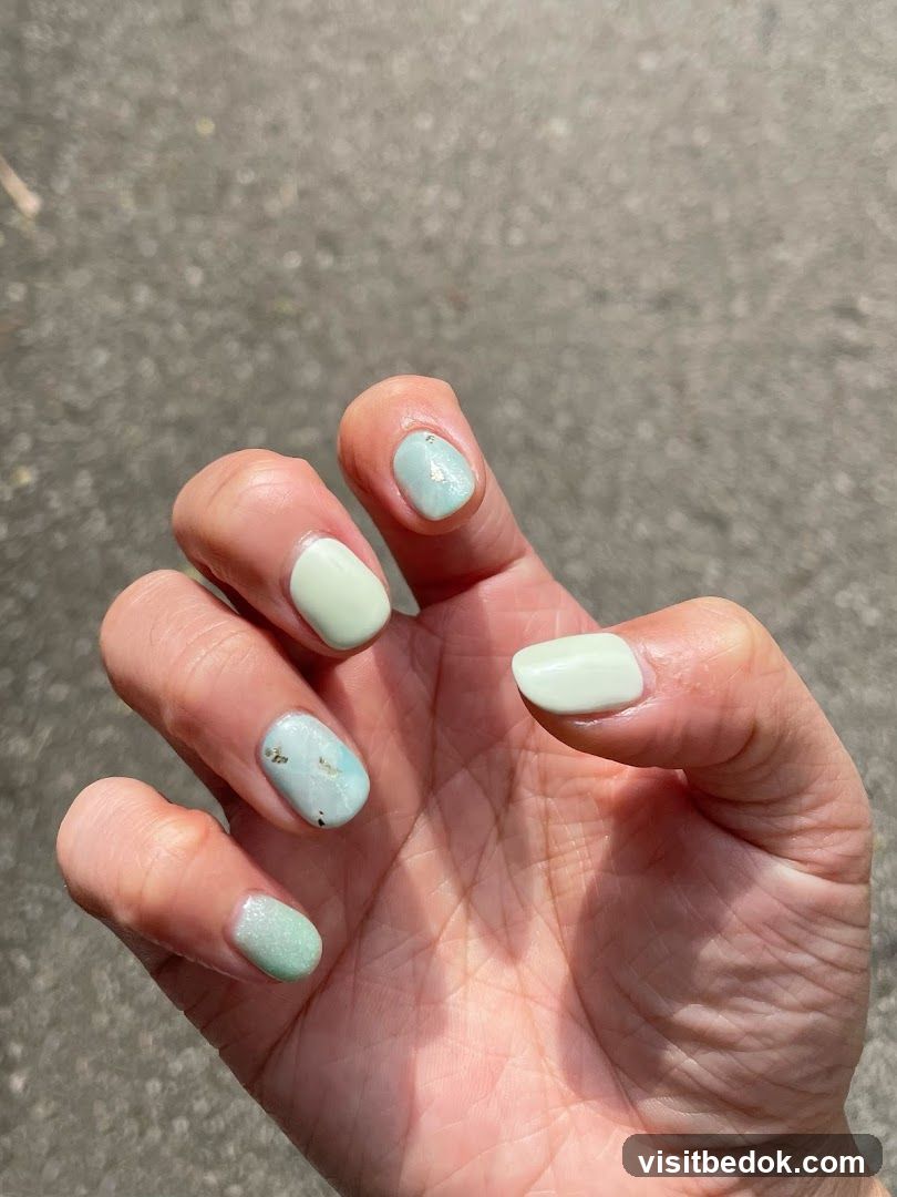 Light Green and Blue Nails with Gold Accents