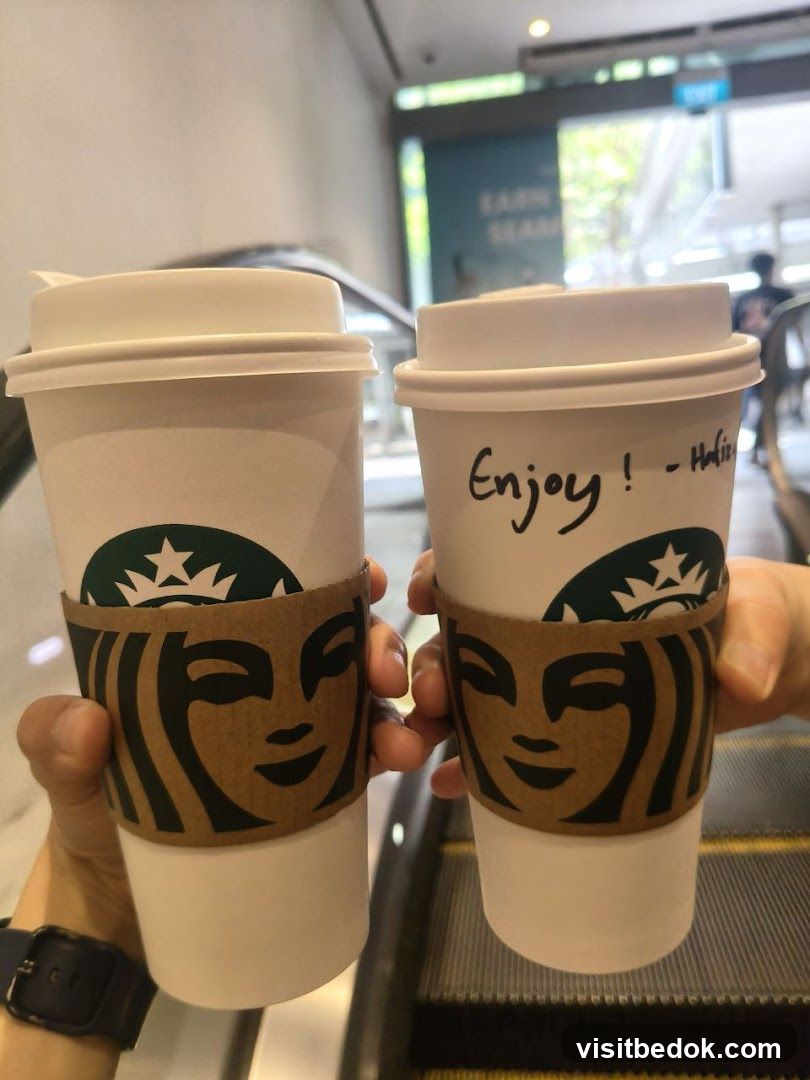 Two Starbucks Coffee Cups