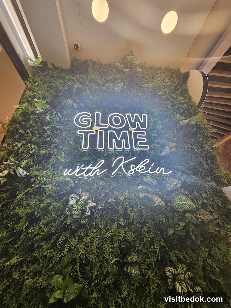 Neon Sign on Green Wall