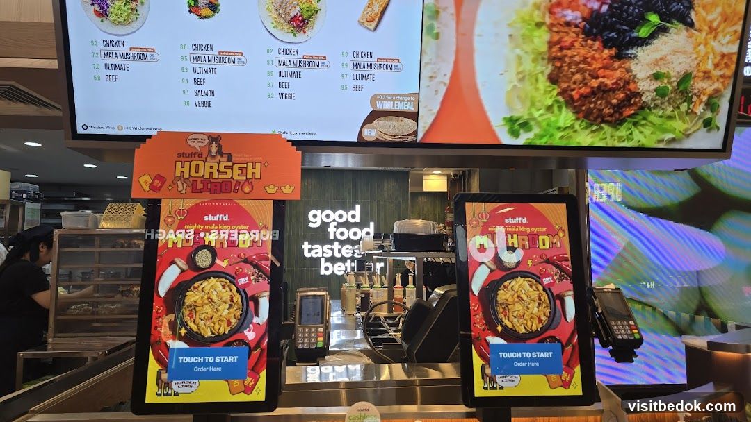 Food counter with digital menus and promotional signs