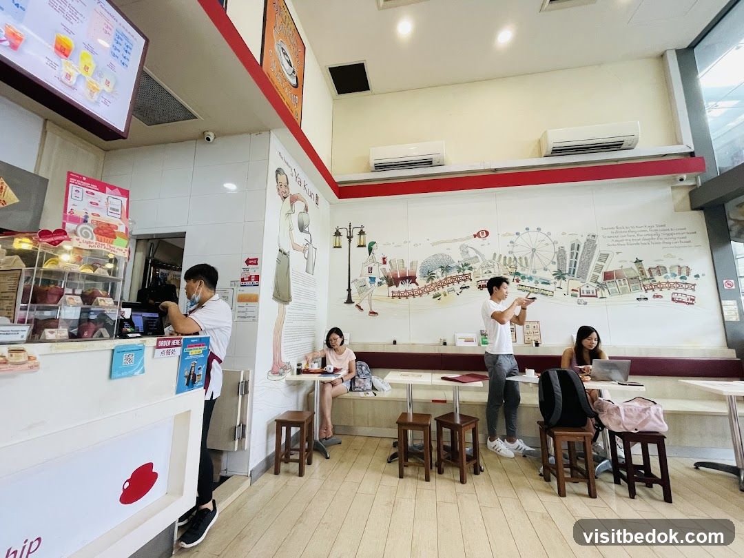 Interior of a cafe with customers and staff