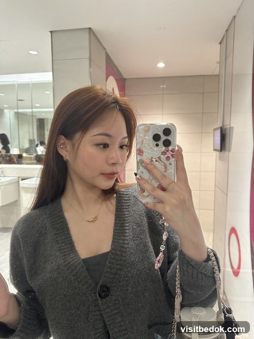 Woman taking a mirror selfie