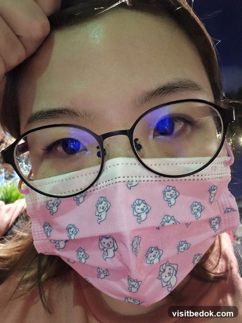 Person wearing glasses and a mask