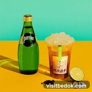 Perrier bottle and iced tea with lime