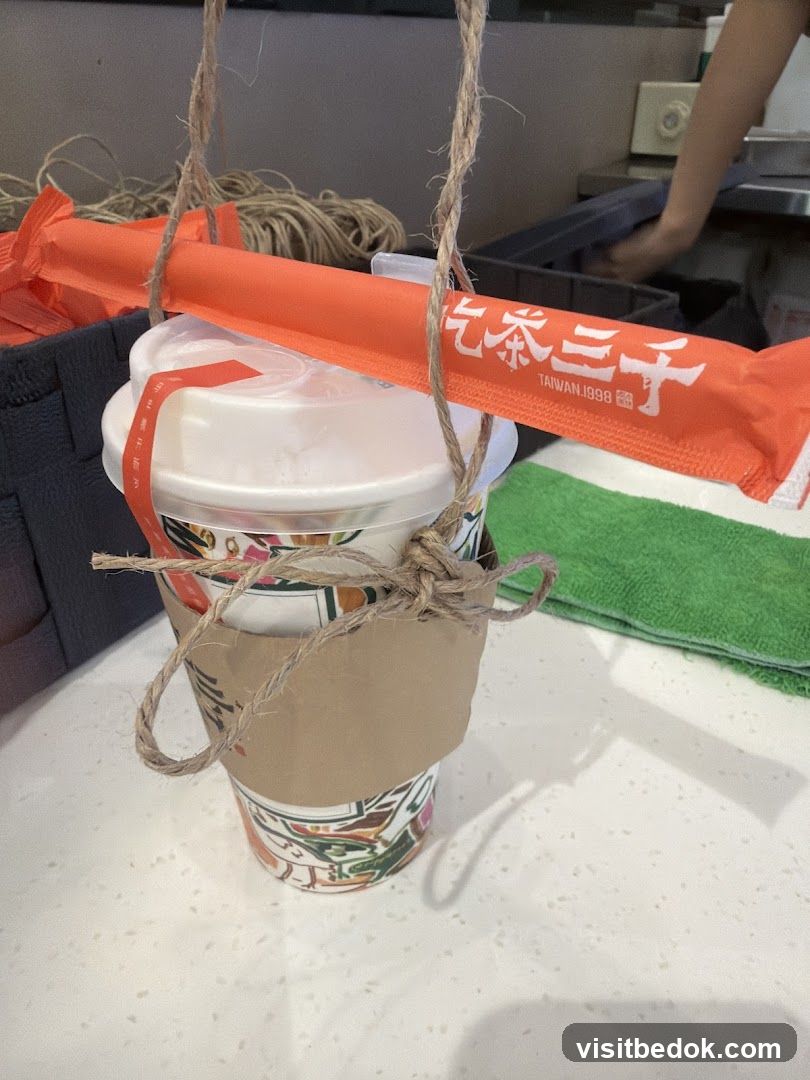 Drink with branded straw wrapper