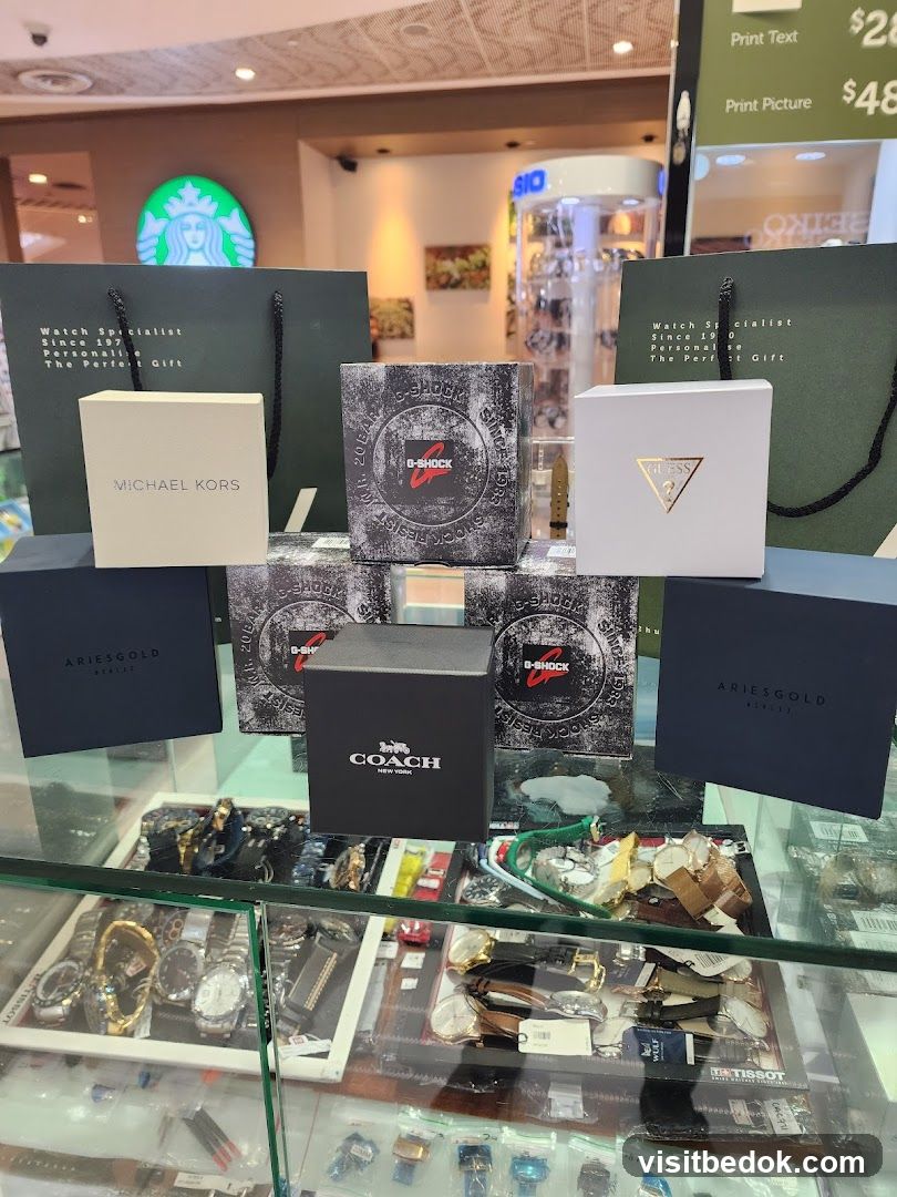 Assortment of branded watch boxes and shopping bags
