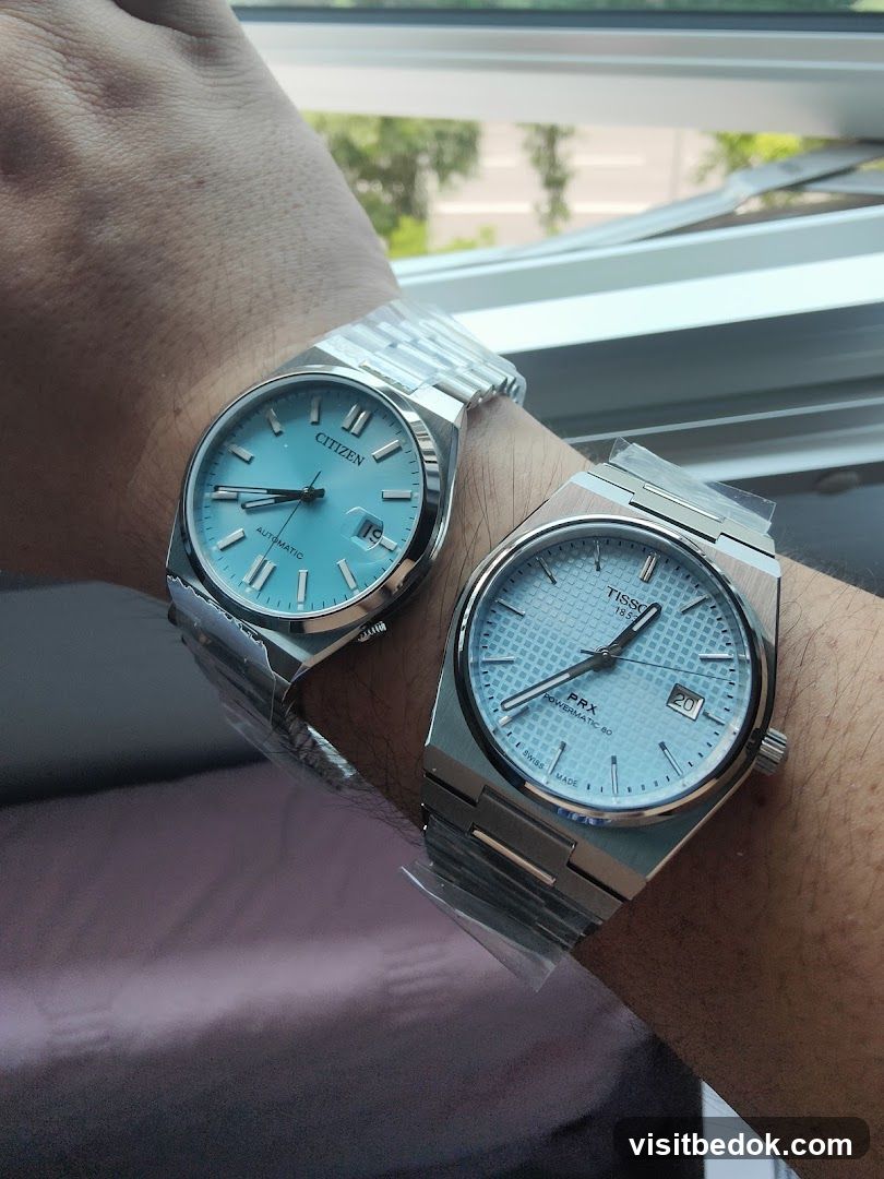 Two watches on wrists