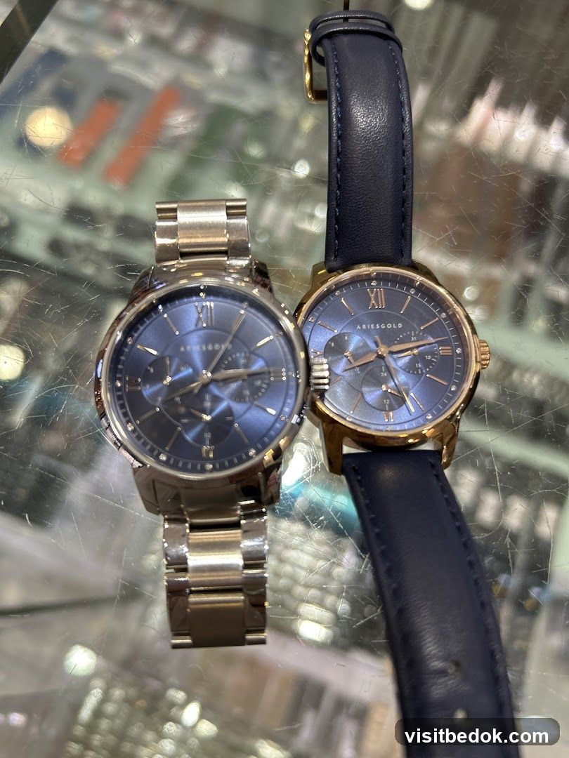 Two Aries Gold Watches