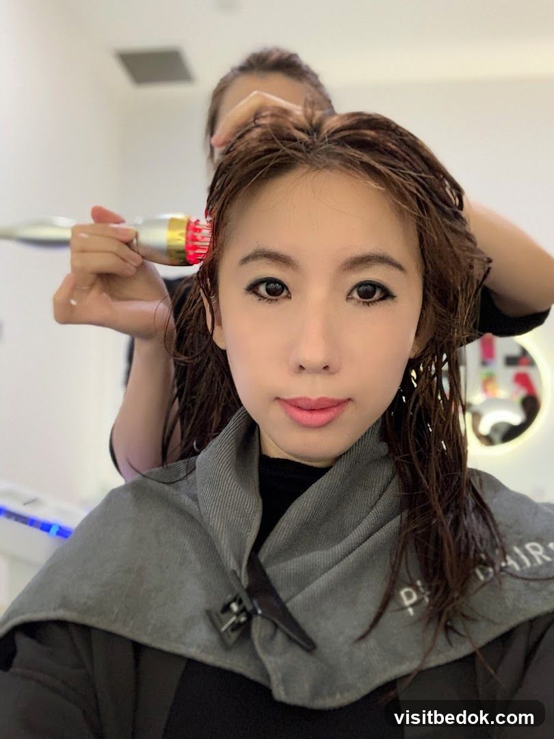 Woman receiving hair treatment