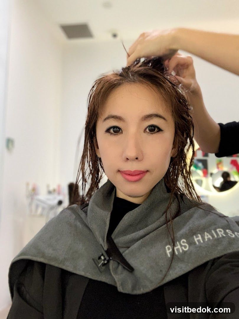 Woman getting hair styled