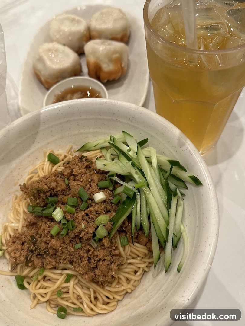 Noodles with meat sauce and pan-fried dumplings