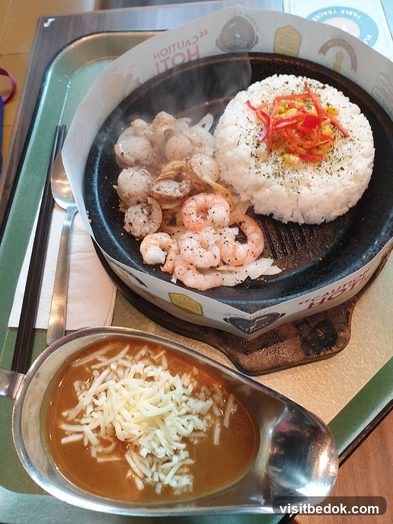 Sizzling Seafood Platter with Rice and Curry