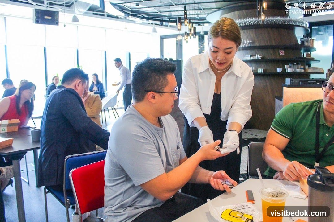 People at a table with a server