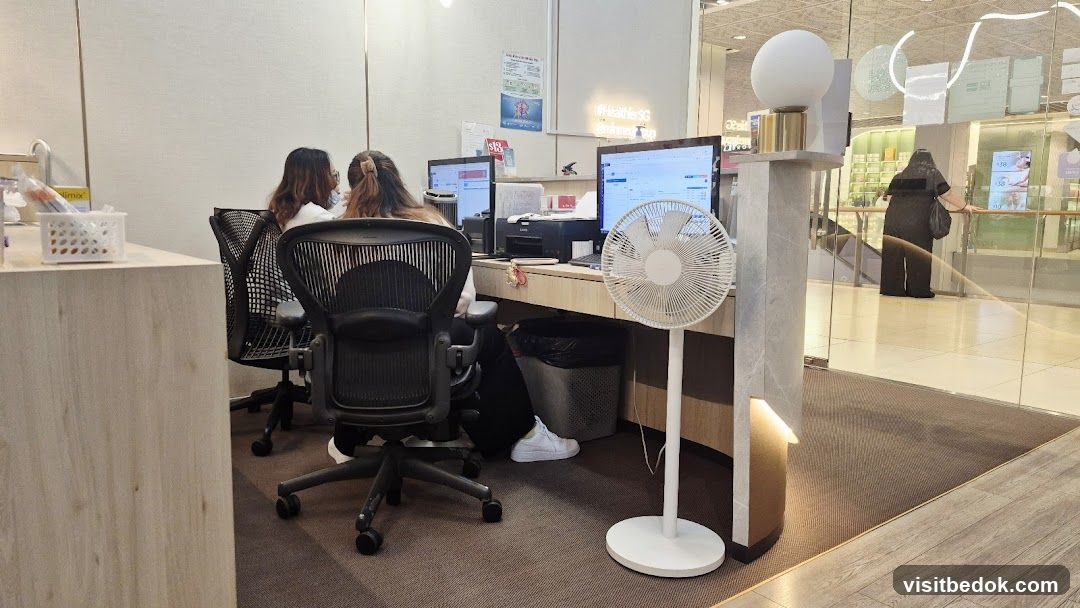Office Interior with Staff and Fan