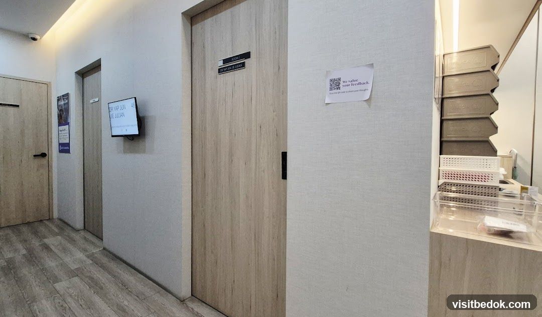 Clinic hallway with doors and feedback QR code