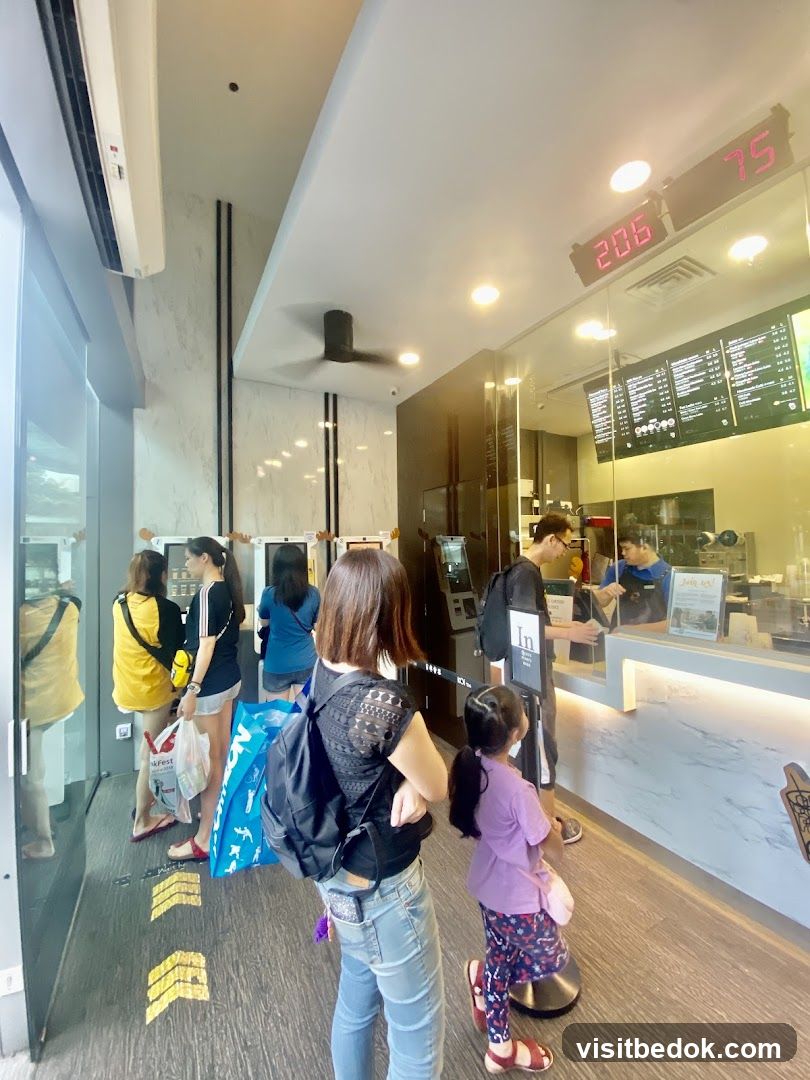 People Waiting in Line at a Food Establishment