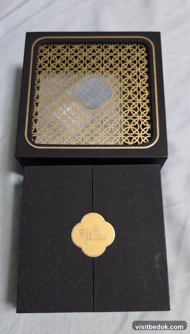 Black gift box with gold accents