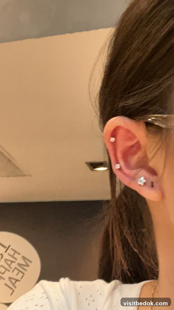 Woman's Ear with Piercings