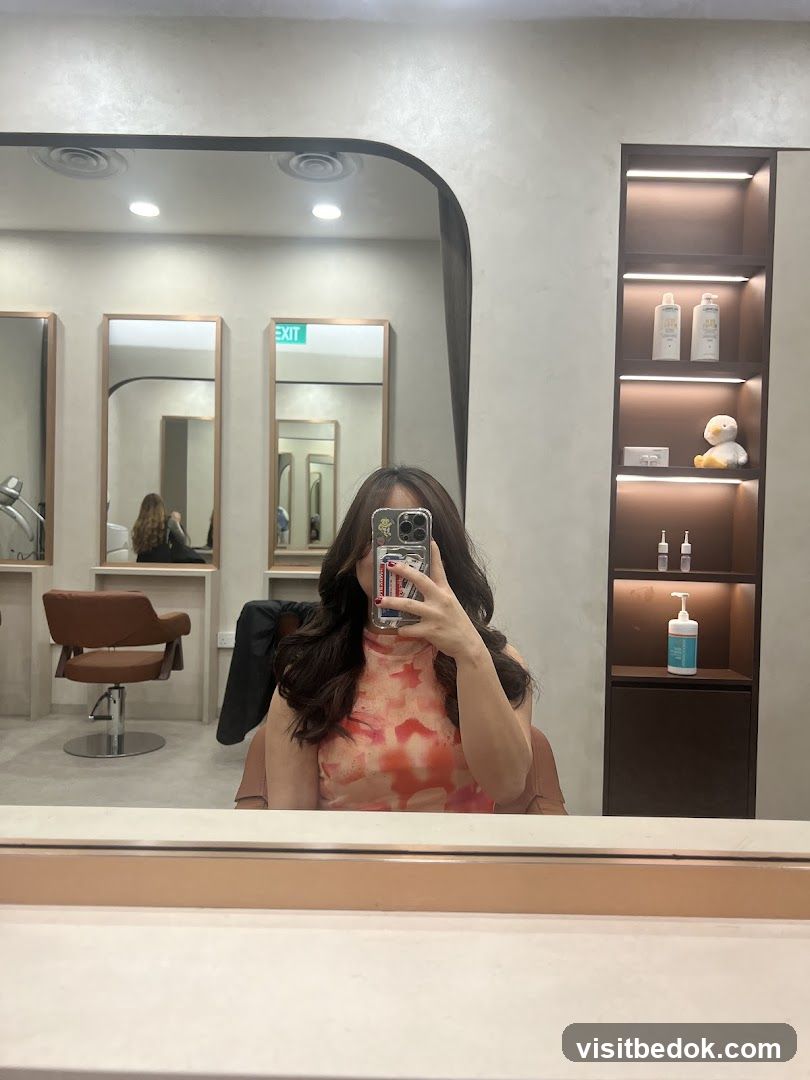 Woman taking a selfie in a salon