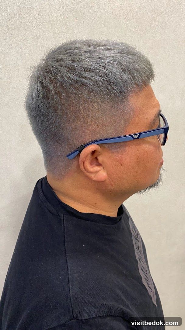 Man with gray hair and glasses