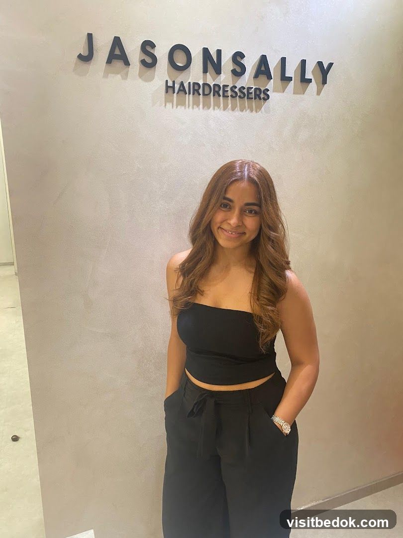 Woman Posing in Front of a Hair Salon Sign