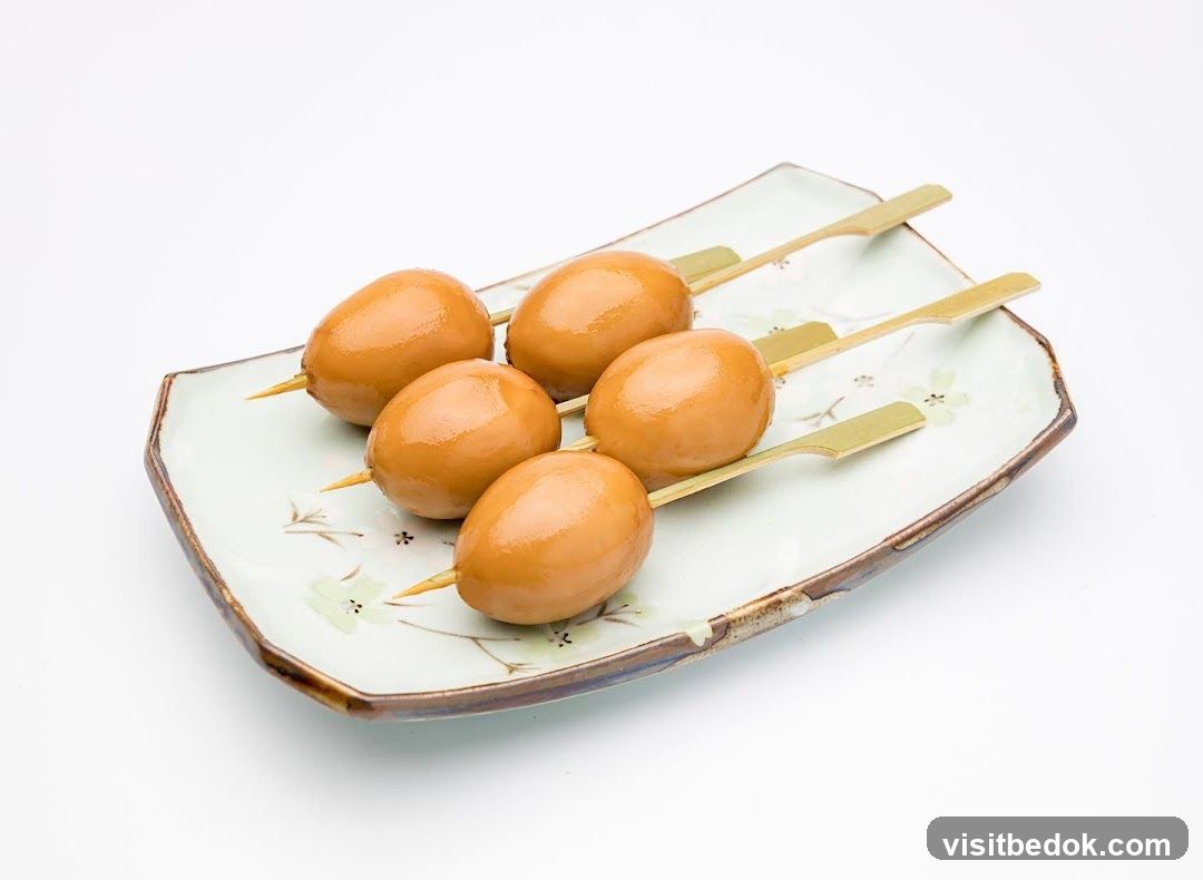 Five Skewered Braised Eggs on a Plate