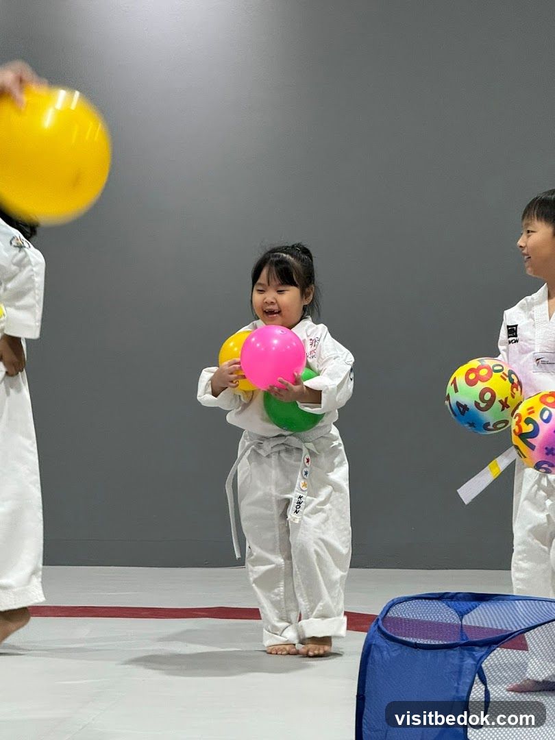 Children in Taekwondo Uniforms with Balloons