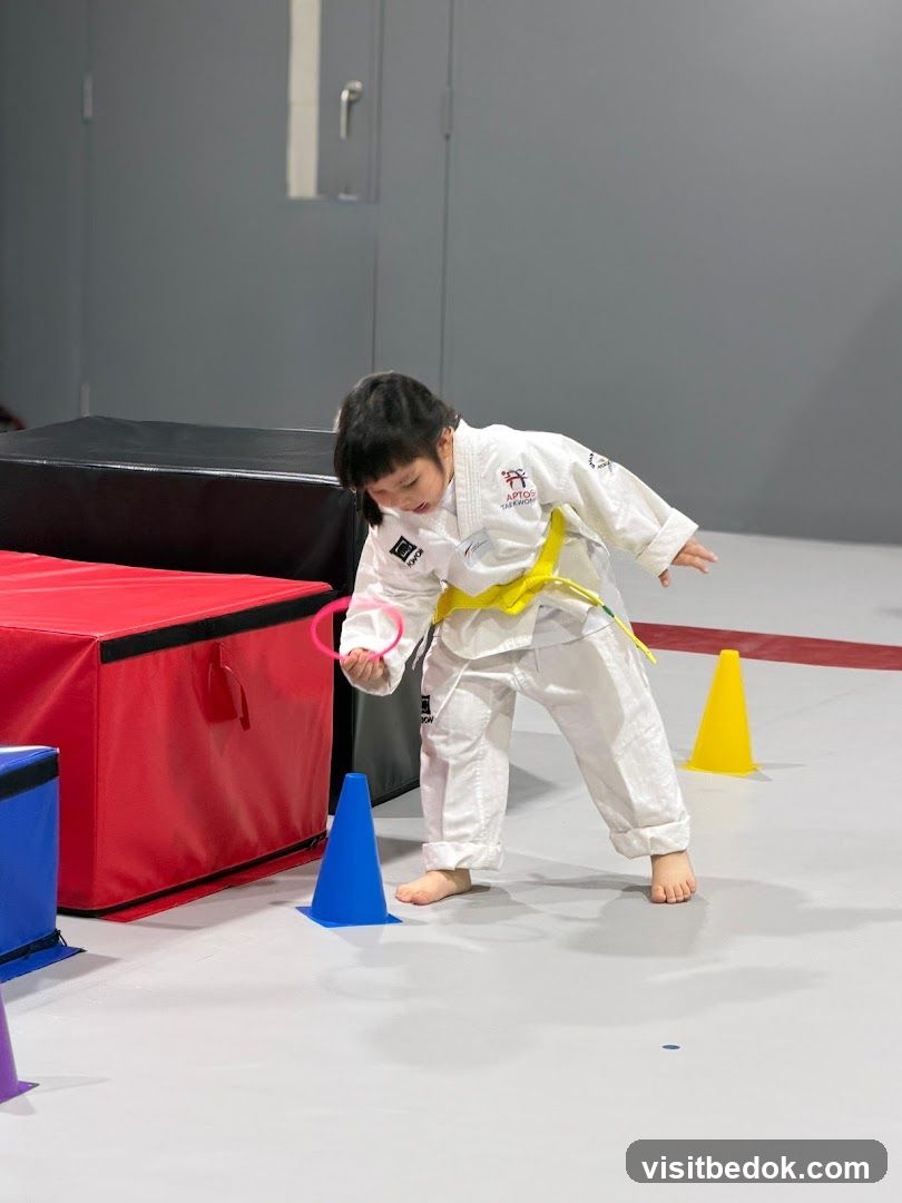 Child practicing Taekwondo
