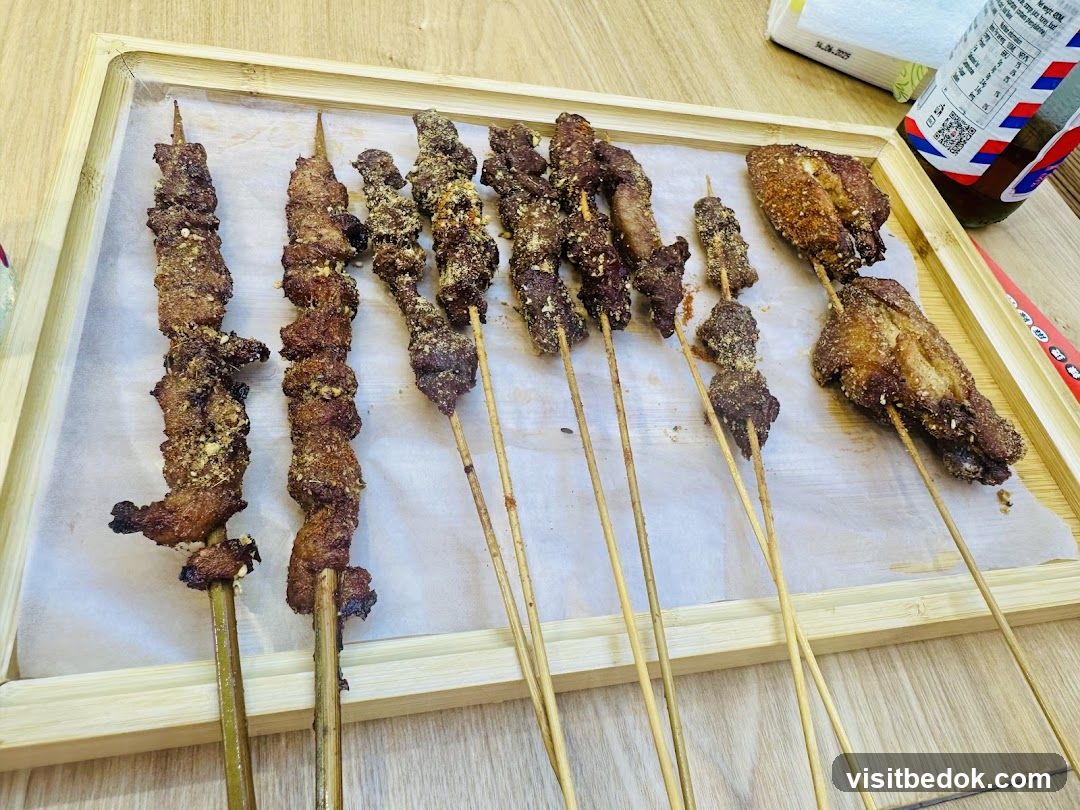 Skewers of meat and chicken wings