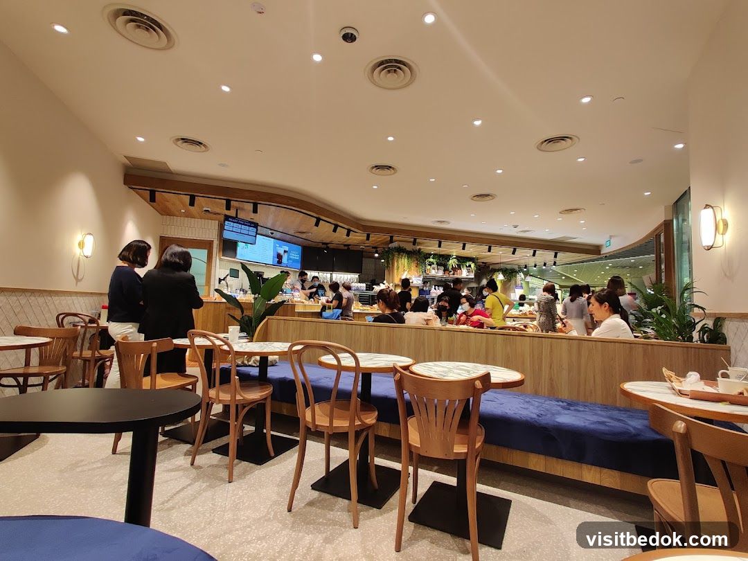 Interior of a cafe with seating and a counter