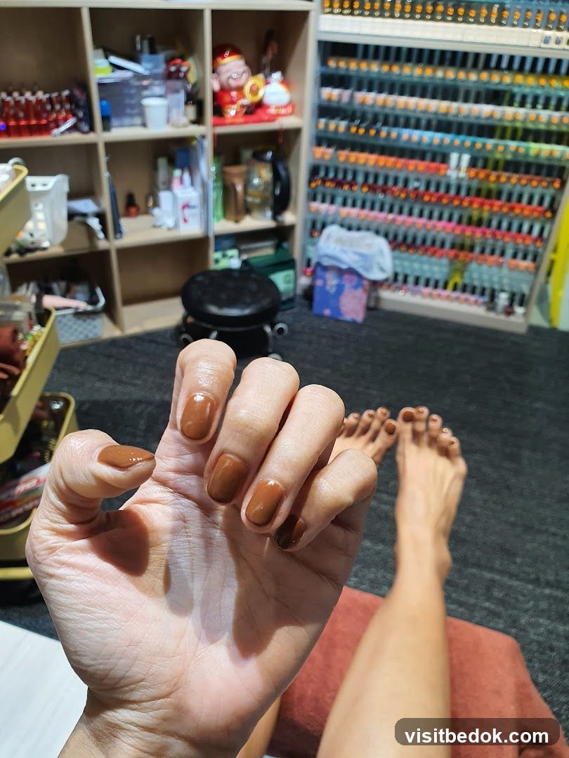 Nail Salon Interior with Manicured Hand and Foot