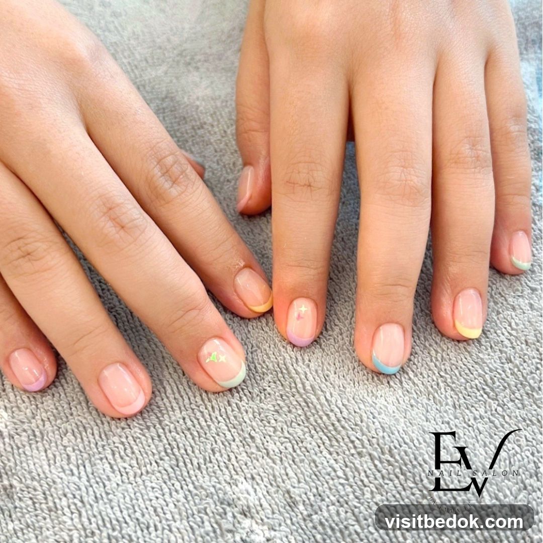 French Manicure with Pastel Tips and Star Accents