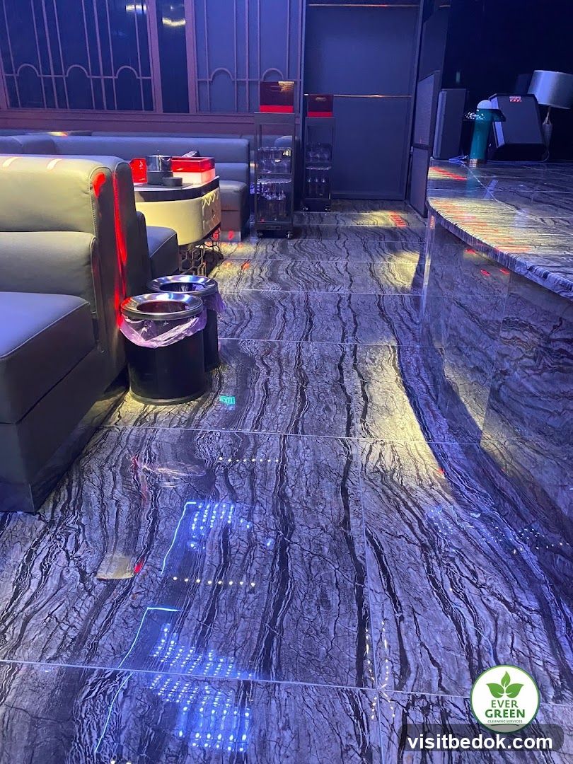Interior of a dimly lit establishment with marble flooring