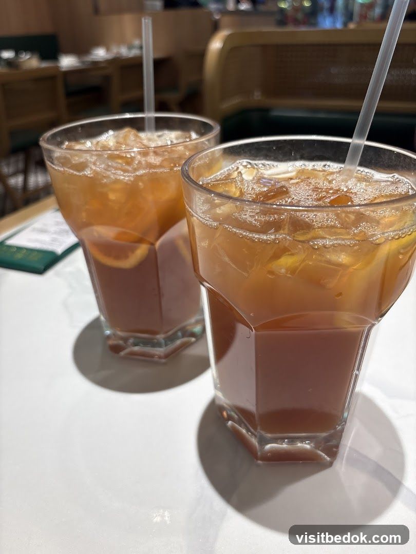 Two iced teas with orange slices