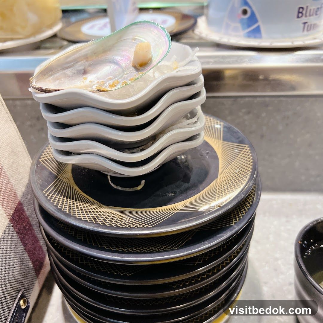 Stack of Sushi Plates with Mussel Shell
